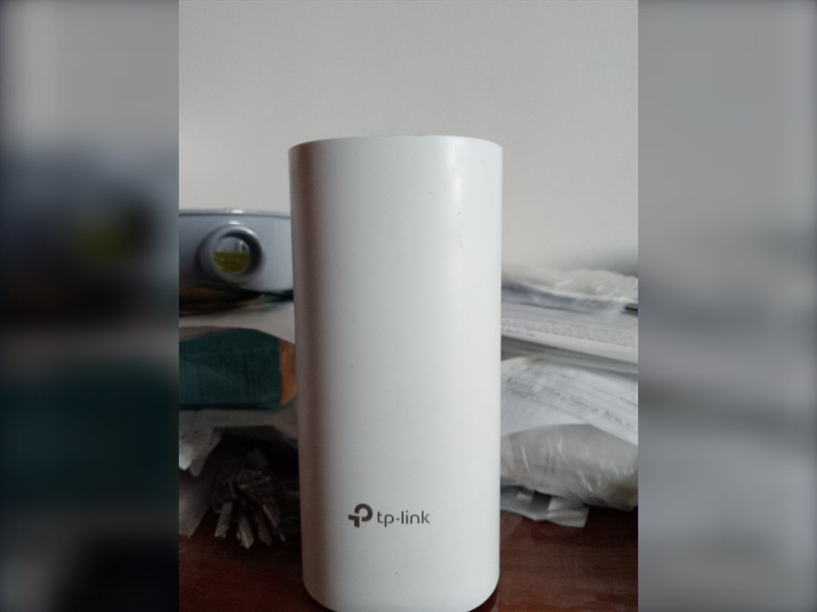 White Wi-Fi mesh node used to extend wireless coverage